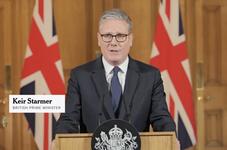 Video still of Prime Minister Keir Starmer speaking at a lectern in front of two British flags
