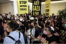 Members of Bay Area Jewish organizations stage a sit-in protest Wednesday in the lobby of Sen. Alex Padilla’s office in San Francisco. Many are wearing black shirts with yellow text that reads, "Jews say let Gaza live"