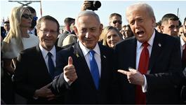 Trump points toward Netanyahu, who is standing next to him smiling and gesturing with his thumb up.
