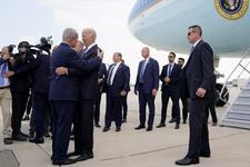 President Joe Biden and Prime Minister Benjamin Netanyahu embrace on a tarmac next to a parked airplane.