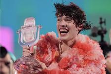 Nemo of Switzerland, holds a crystal trophy and celebrates after winning the Grand Final of the Eurovision Song Contest