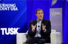 David Milstein, a top official in the U.S. Embassy in Jerusalem, is seated in a white armchair