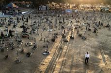 A man walks away from a memorial on the grounds of the Nova music festival
