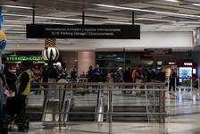People move inside International Arrivals at George Bush Intercontinental Airport.